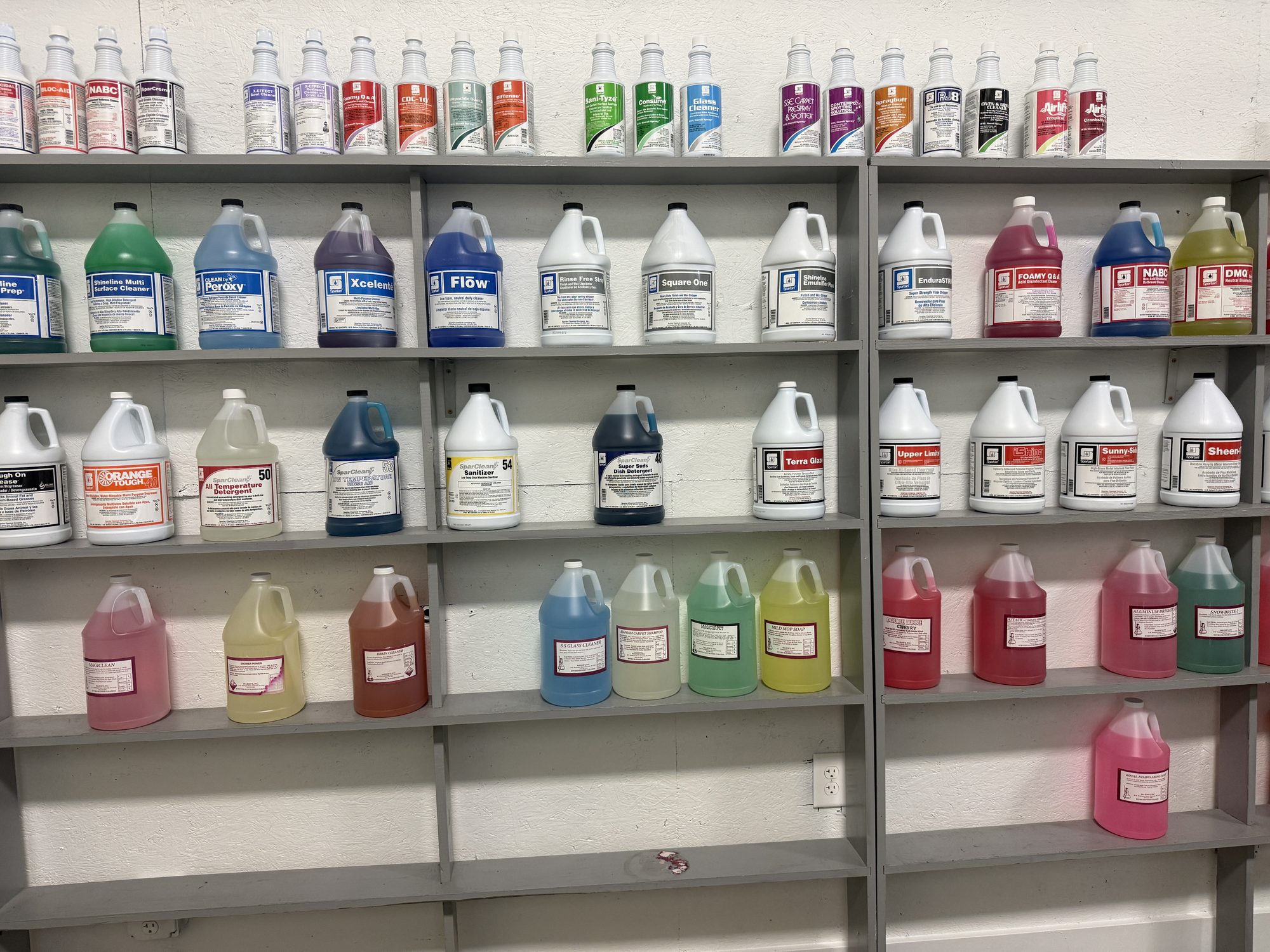 Shelves of cleaning chemicals in the McLeod's showroom