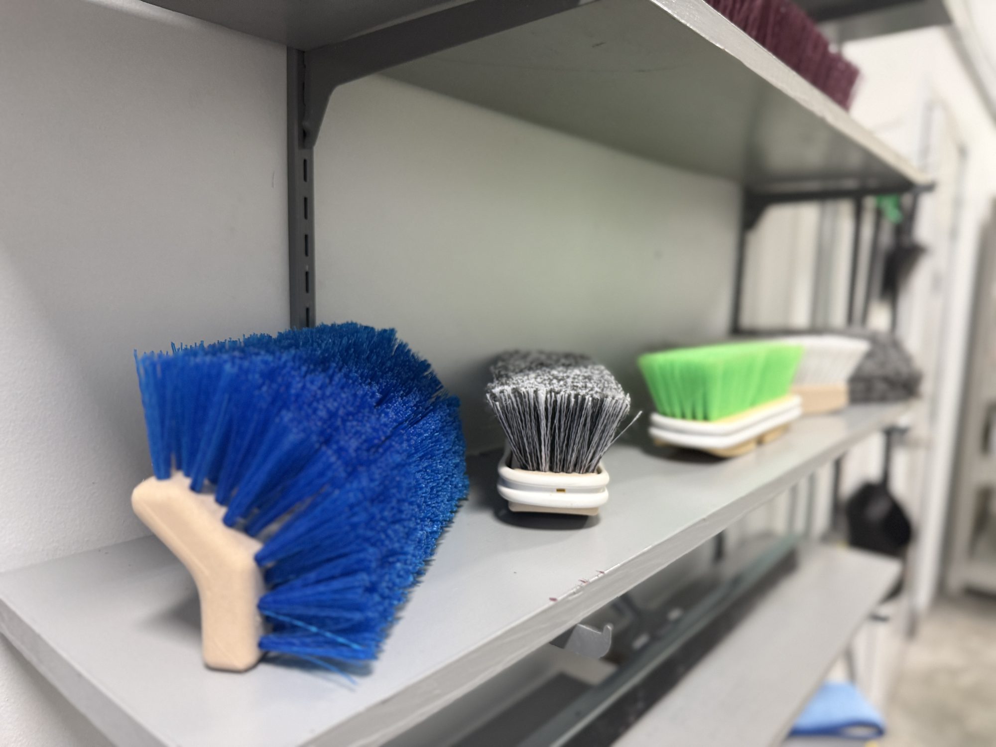 Scrub brushes and cleaning supplies in the McLeod's showroom